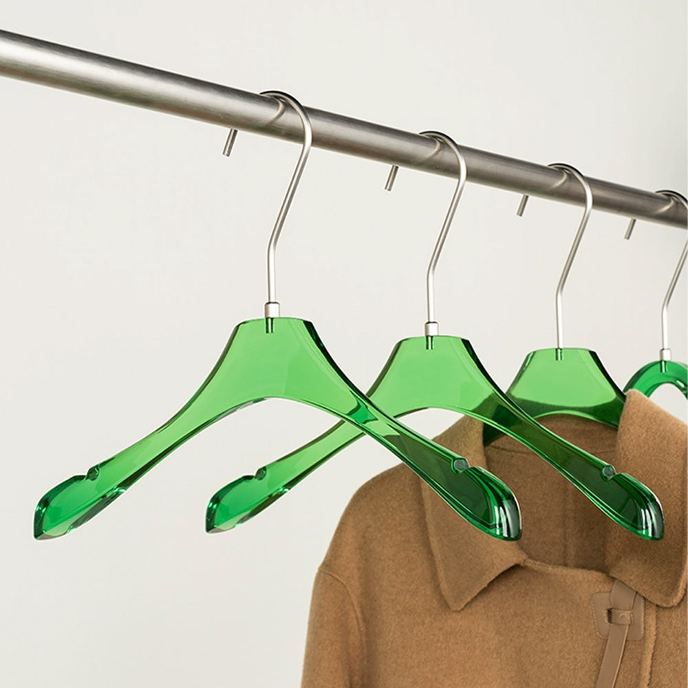 Clothes hanging on hangers in women clothing store