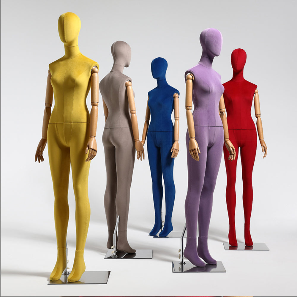 Female mannequins standing in store window display of women casual